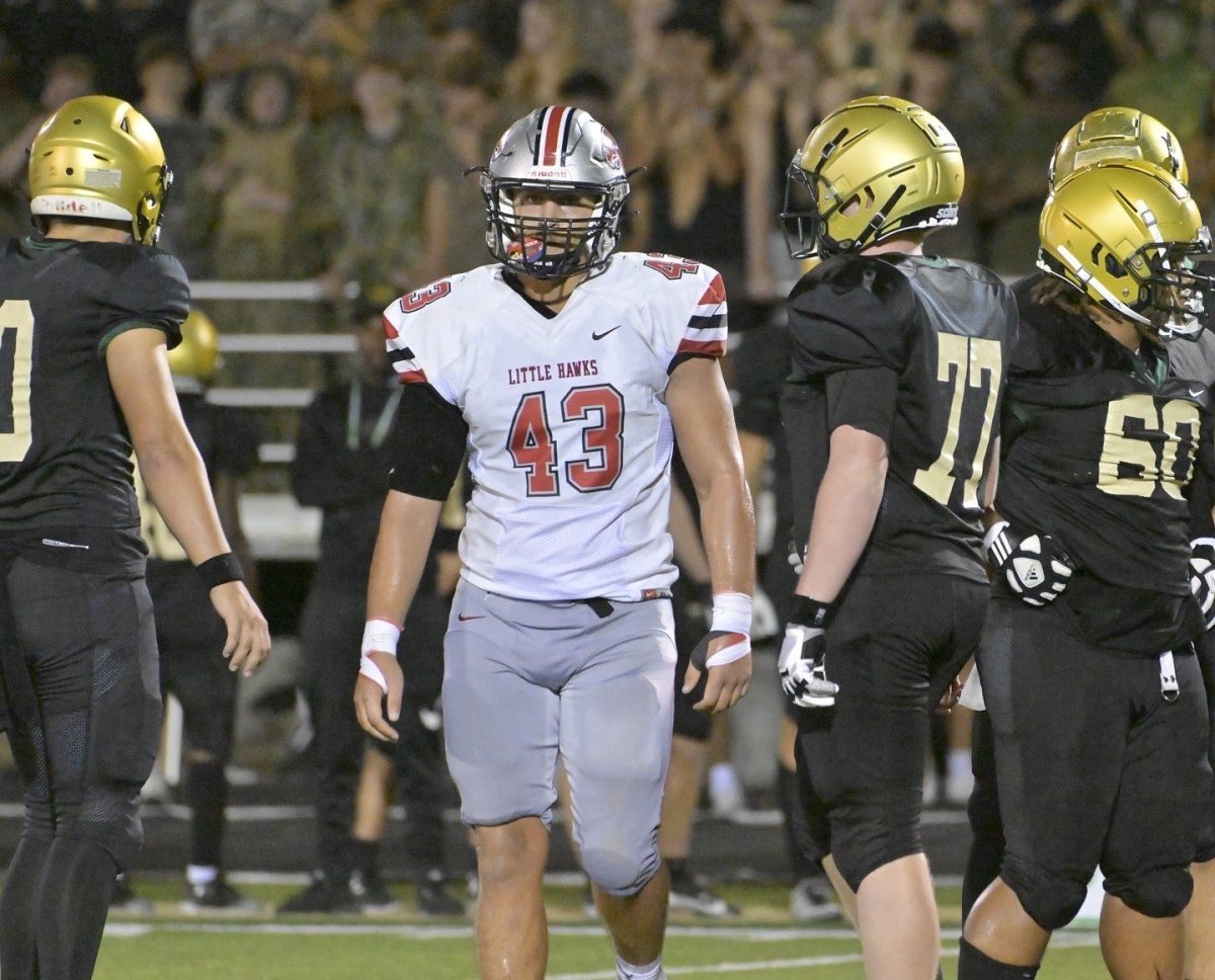 Kane Willey catches his breath between plays against cross-town rival Iowa City West.