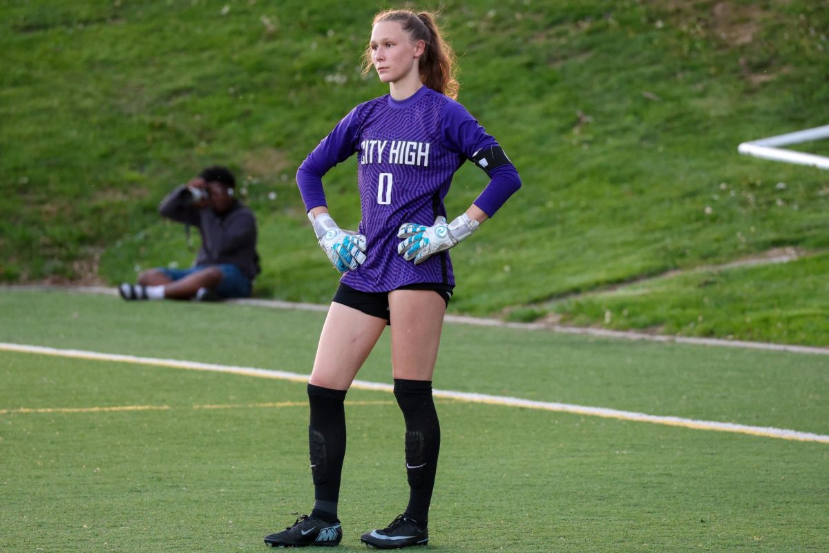 Mira Gollnick '26 stands at goalie with the ball on the other end during a game vs. Xavier. Gollnick has played goalie all four seasons for the Little Hawks. 