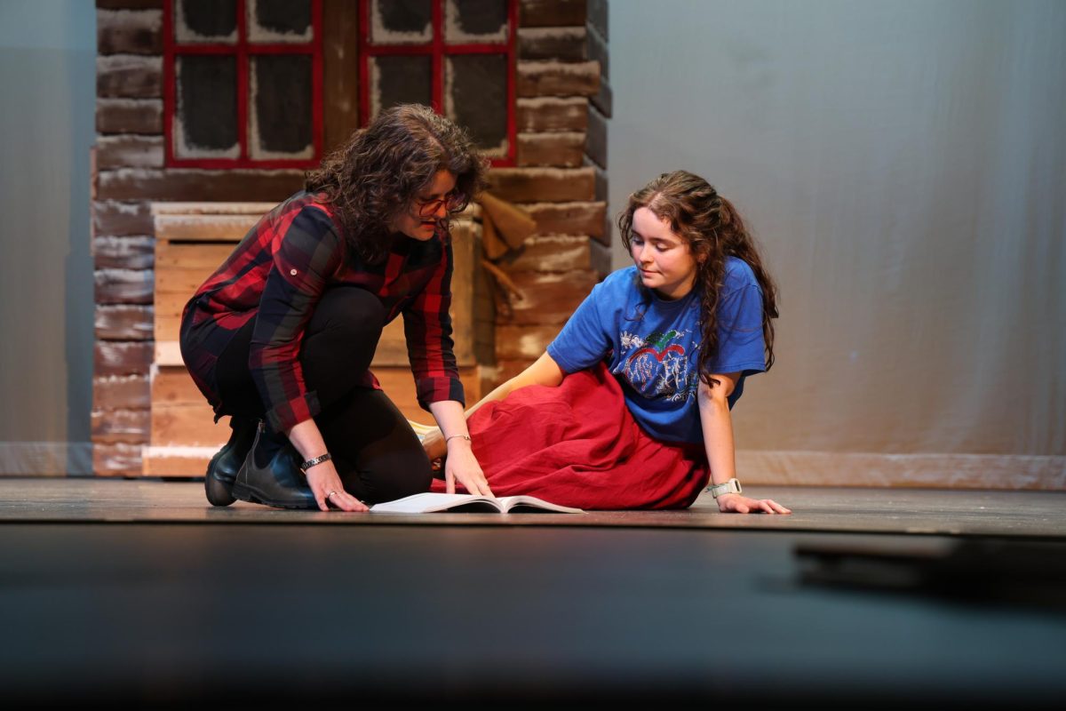 Director Lauren Darby discusses a scene with Jillian Leman '26, who plays Anna in the spring musical.
