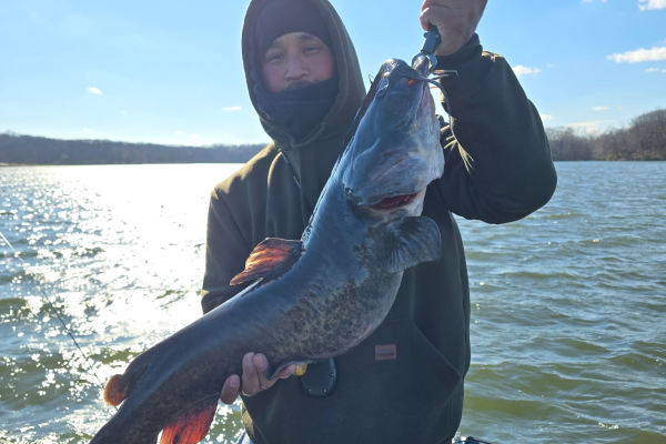 Kato Lo poses with the fish he caught over Easter weekend fishing with his Dad on Lake MacBride