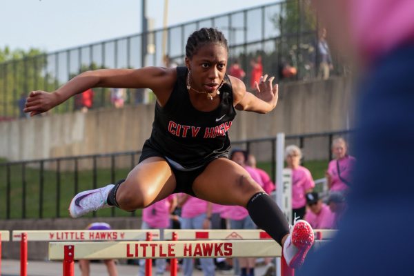 Starting off the shuttle hurdle relay race Gloria Konu '26 bolts out of her blocks and clears hurdle after hurdle.