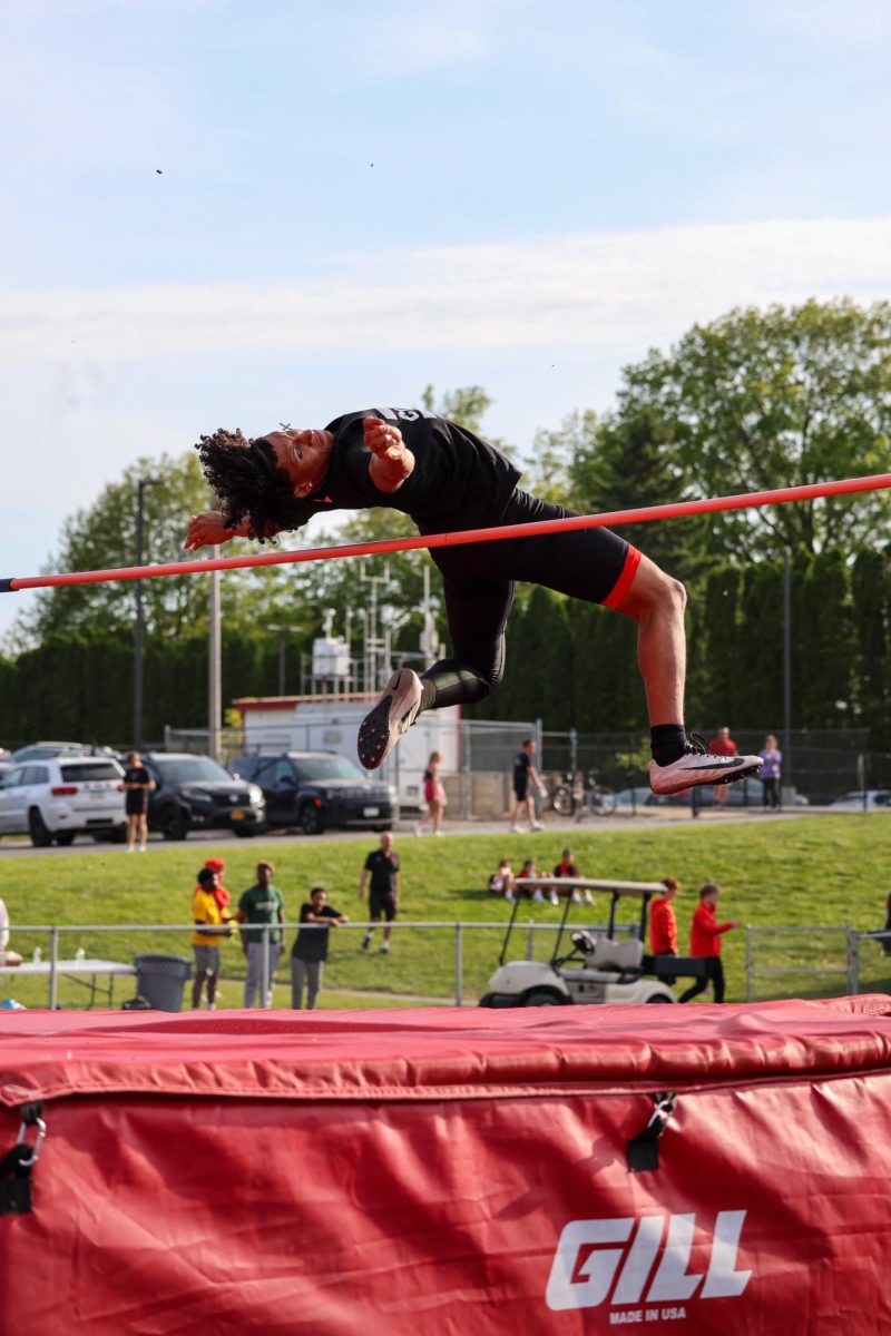 Abe Bidanis 27' high jumping at the state qualifier meet 