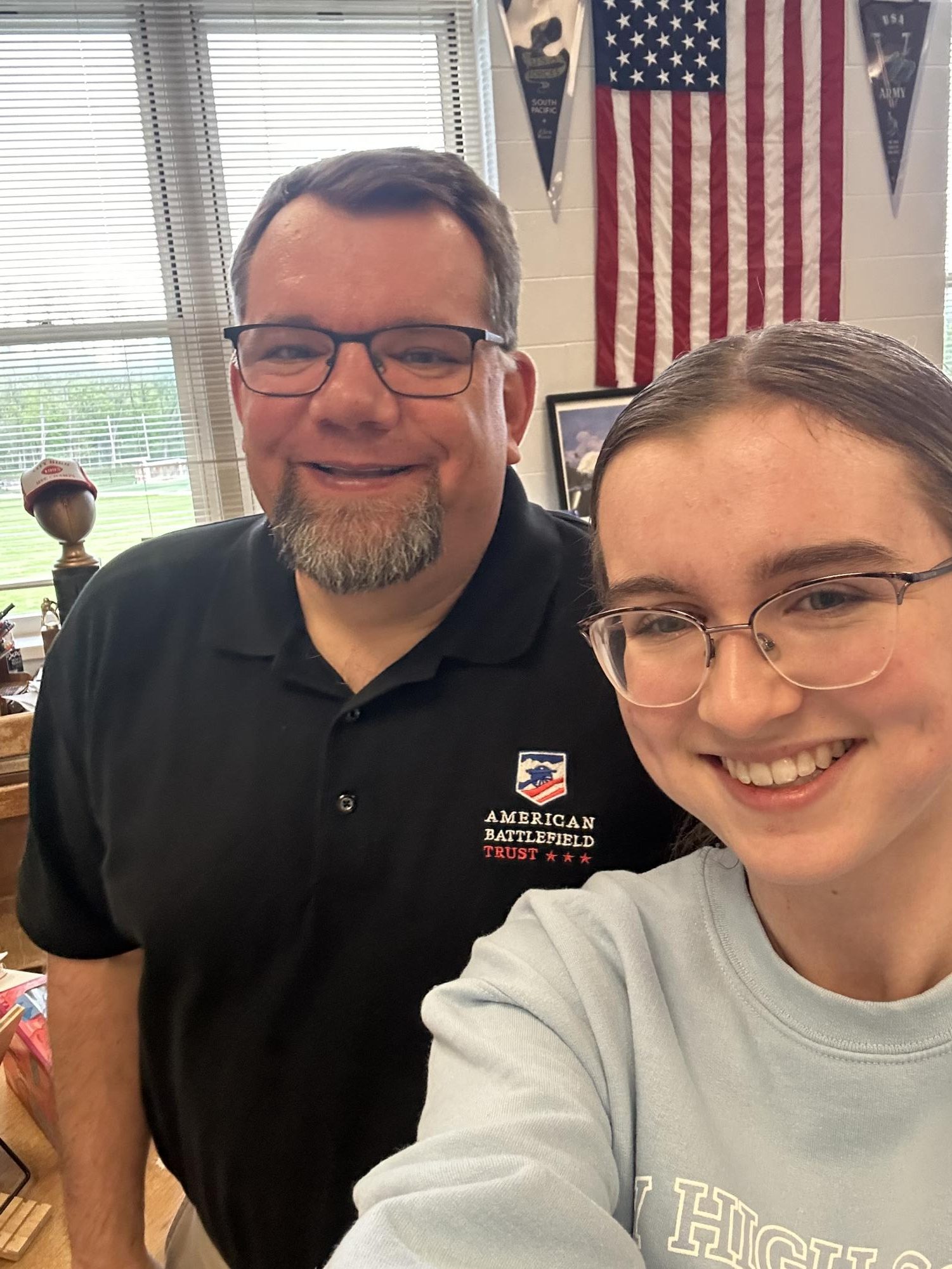 Mr. Hellwig and Lily Sheerin pose before a class on the Civil War.