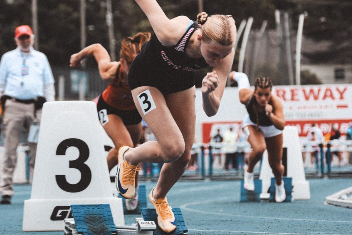 Springing out of her blocks Willow Schultz '27 starts her 400 meter hurdles race.