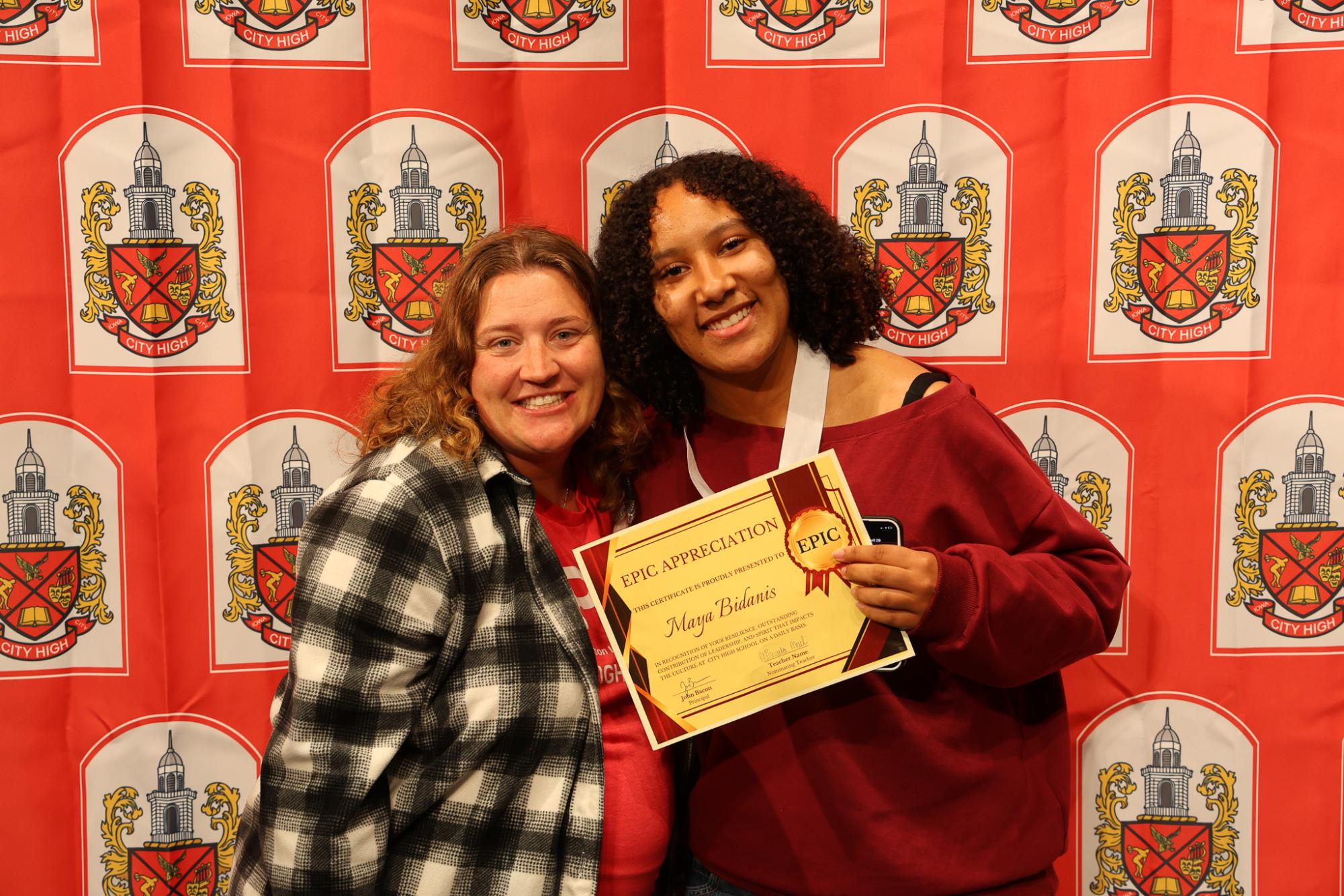 Michaela Moel teaches Earth and Space Science at City High.  Ms. Moel and Maya Bidanis are posing at the EPIC Awards Ceremony.